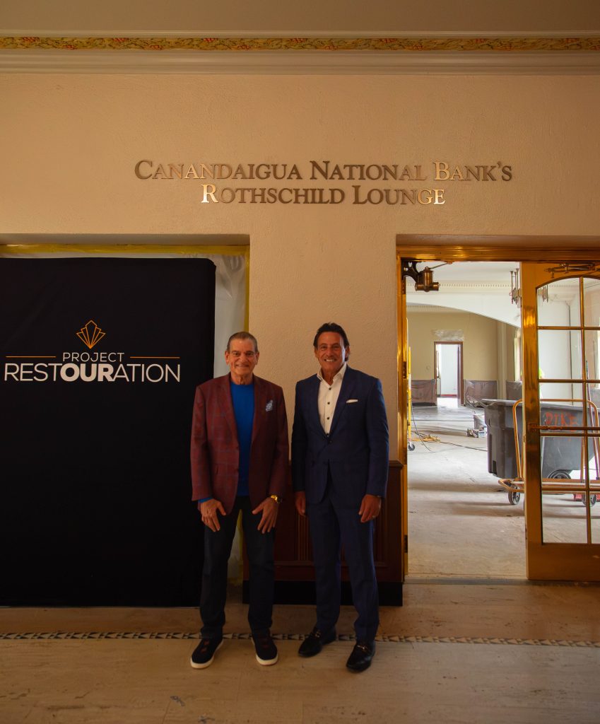 Two men standing in front of lounge under construction